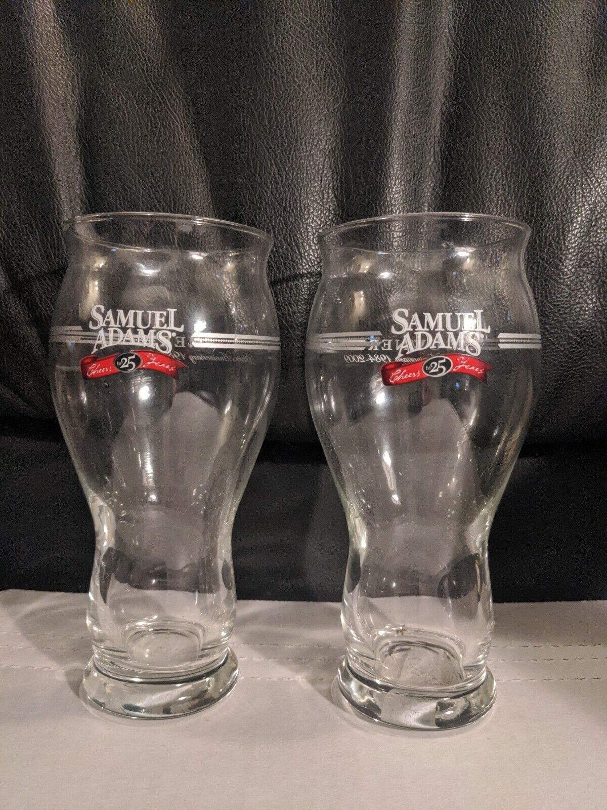  Samuel Sam Adams Boston Lager Glass 16 Oz. "Owner 1984-2009" Silver Lot of 2 Samuel Adams