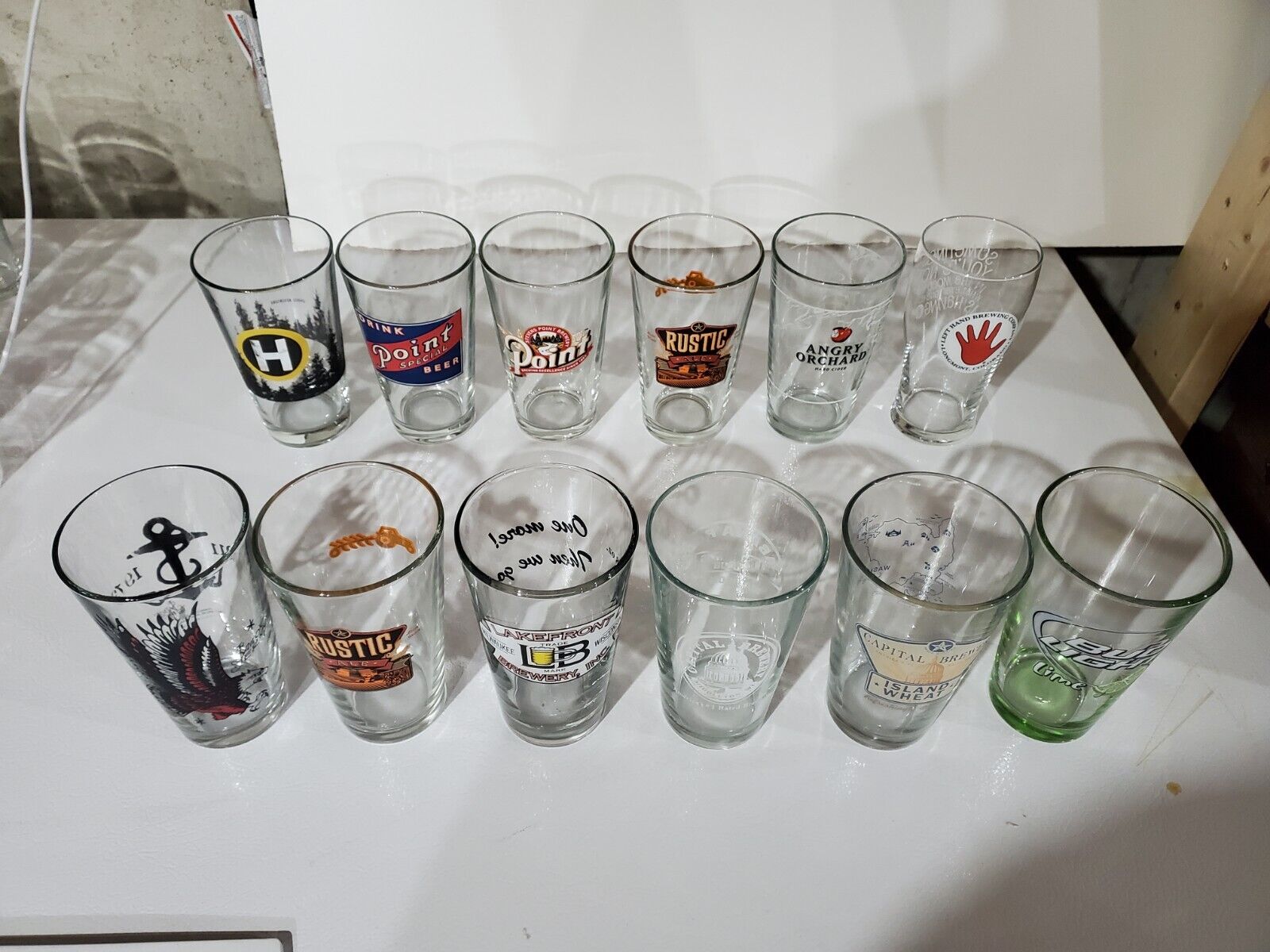 (12) Assorted Brewery Pint Glasses Multi
