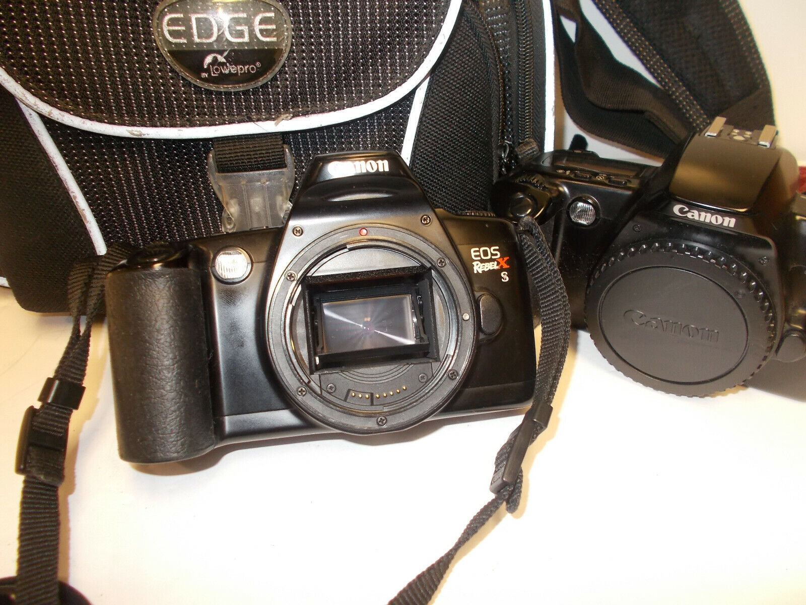 2 CANON EOS Rebel X 35mm Cameras with very nice case cameras not tested Canon Does Not Apply