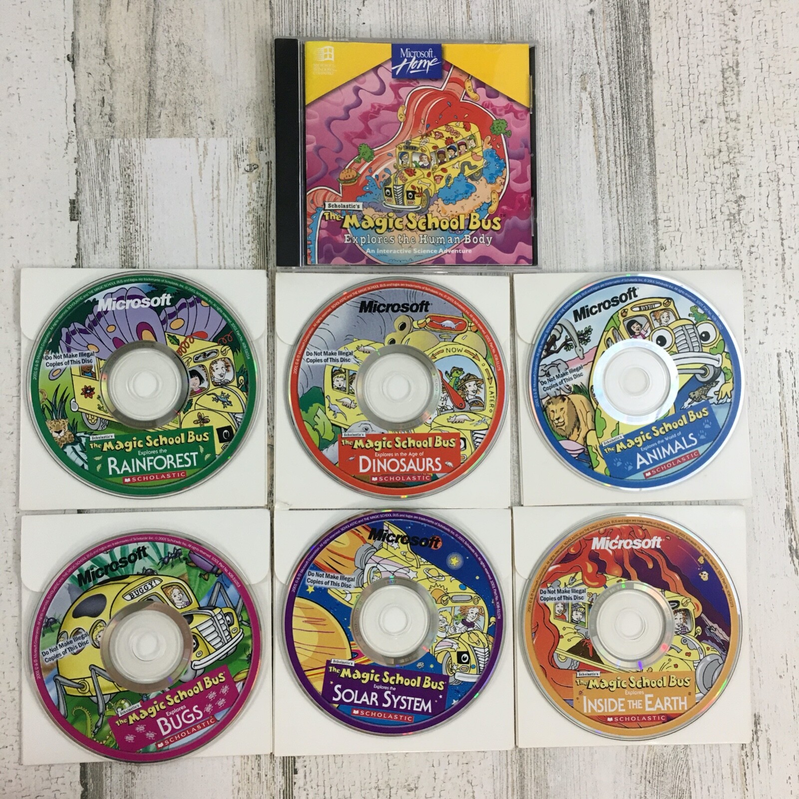 Scholastic The Magic School Bus 4 Game Lot PC CD-ROM Solar Earth Bugs Dinosaurs Scholastic 23456