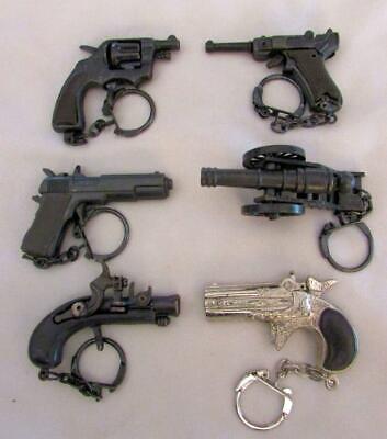 Set of 6 Mini Diecast Cap Gun Keychains 45, 38, Lugar, Cannon, Pirate,Derringer Без бренда