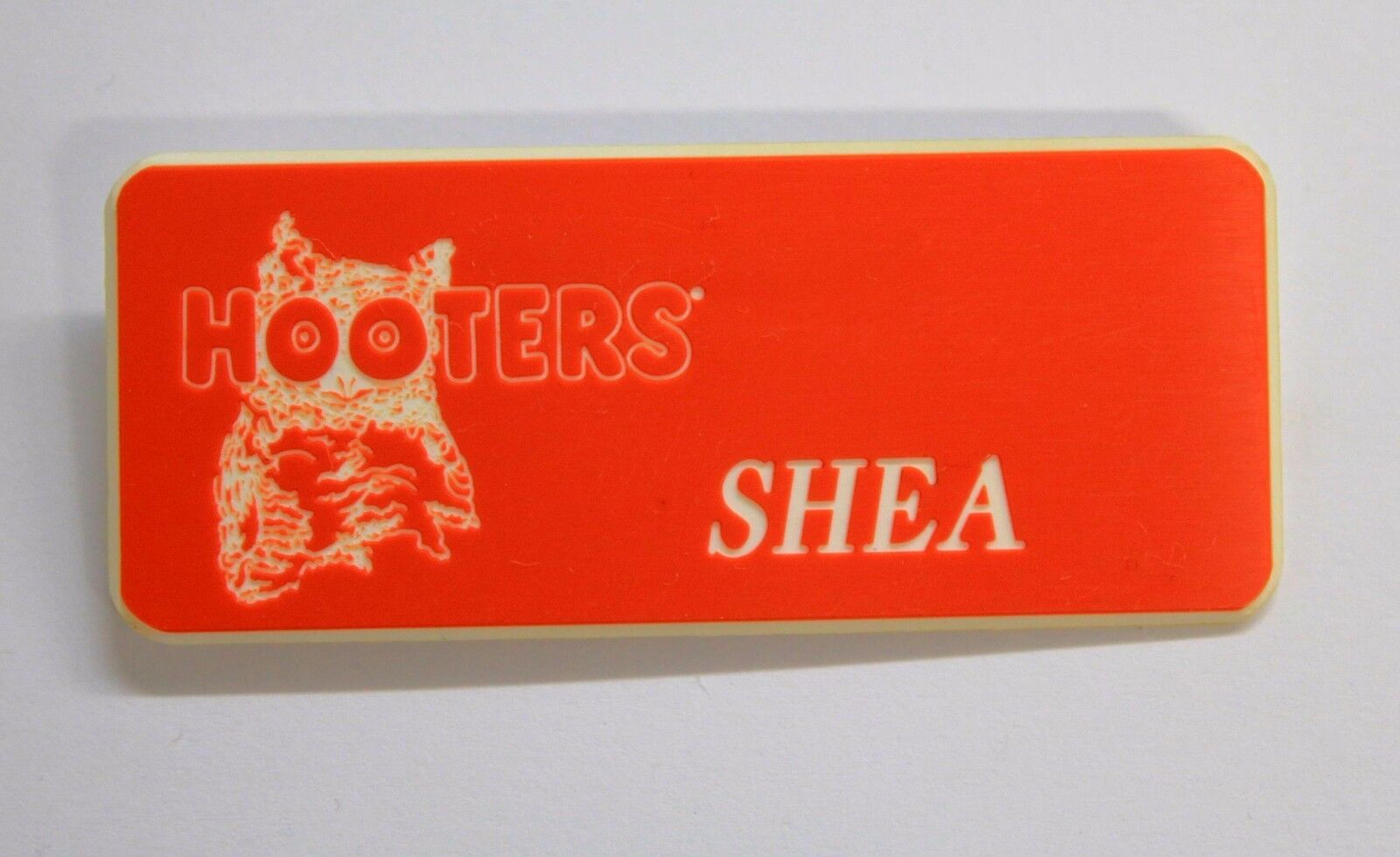 SHEA - HOOTERS RESTAURANT ORANGE NAME TAG W/ WHITE LETTERS (PIN) SHEA Hooters