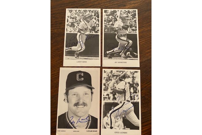 Four signed baseball player photos