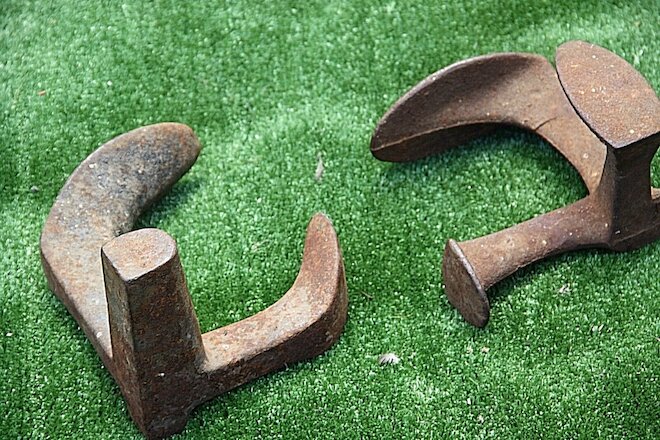 antique Boost lasts  door stoppers pair two very old cast iron boot lasts pair