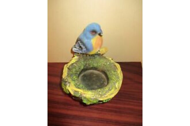 Bluebird Sits on Nest Figure