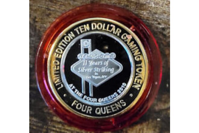 2010 FOUR QUEENS $10 RED Cap .999 Silver Strike 11 Years of Silver Striking Sign