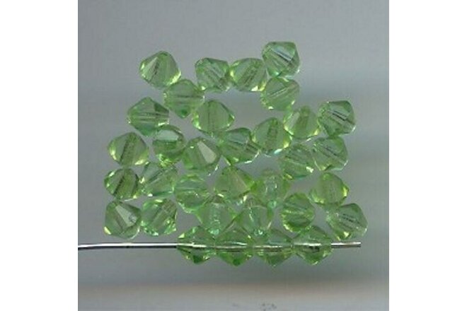 50 VINTAGE GLASS PERIDOT 6mm. FACETED BI-CONE BEADS 402