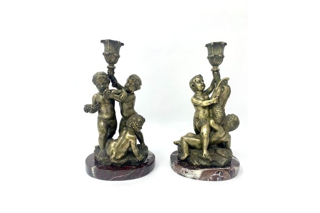 Unusual pair of antique Continental bronze figural candlesticks