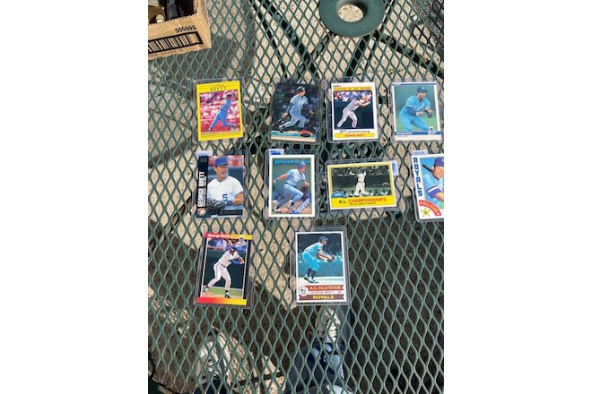 Lot of 10 George Brett Baseball Cards in hard plastic sleeves.