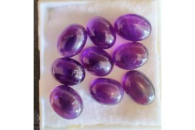 Lot of amethyst cabochons 16x12. Old stock Thaigems with tags. Nice color.